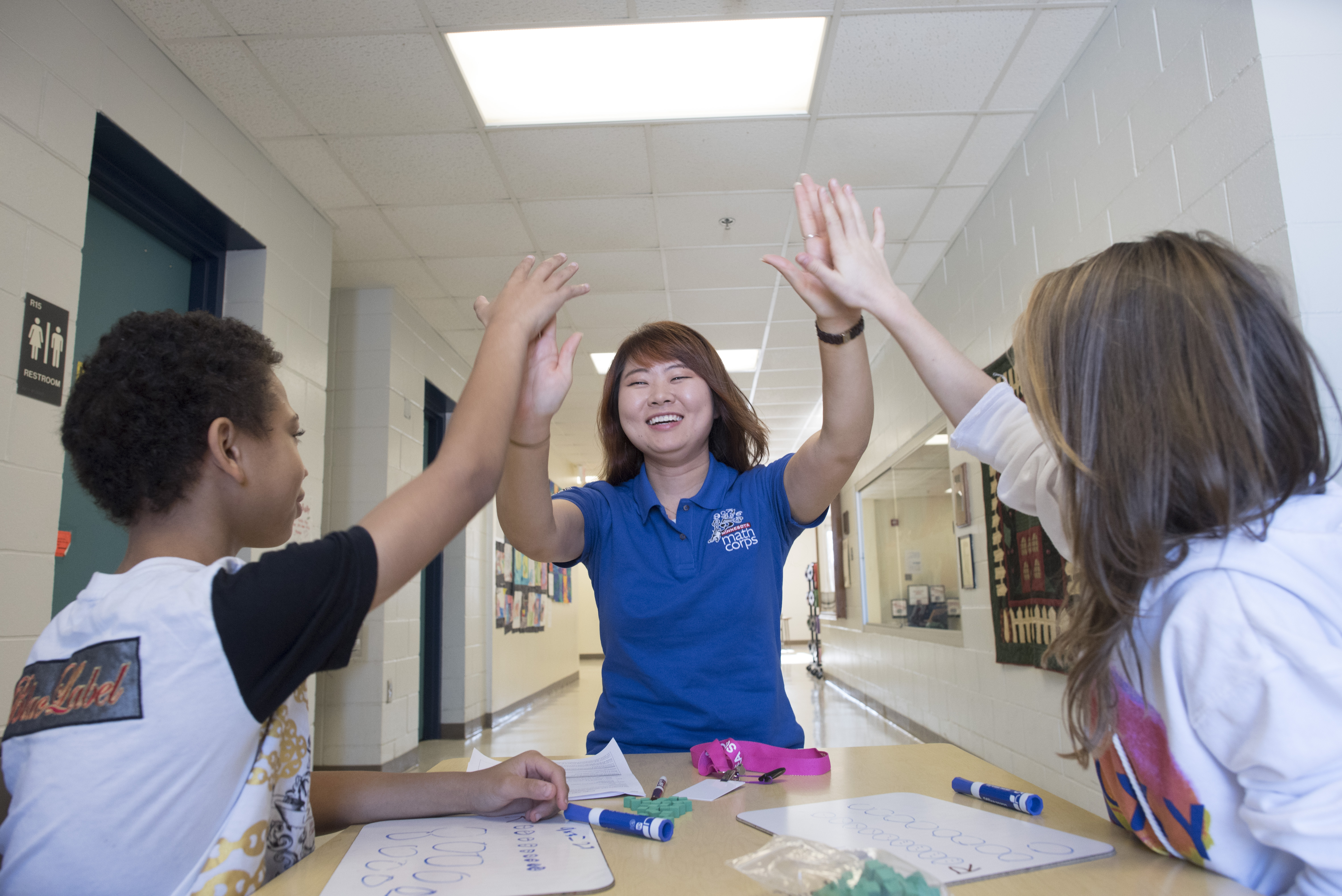 MN AmeriCorps member with kids afterschool